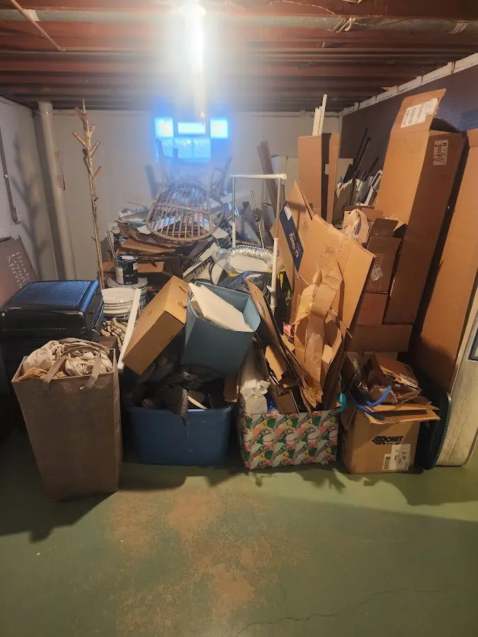 Roll-off dumpster container at job site for 4 Yard Dumpster Rental in Algoma