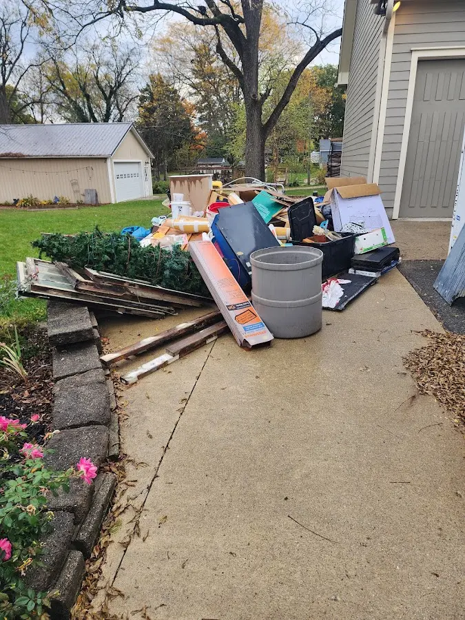 Dumpster being loaded with debris for Residential Dumpster Rental in Algoma
